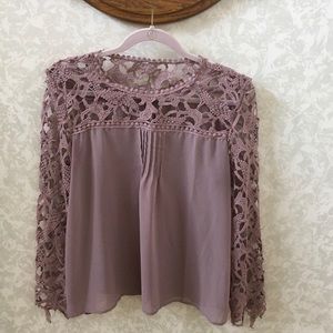 Crocheted Lace sleeve sheer blouse.