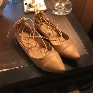 Nude lace up flats