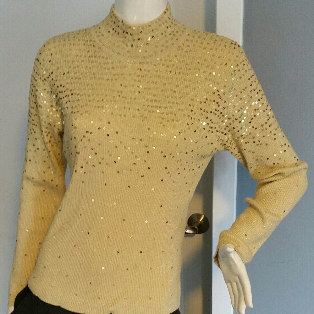 Gold knit top with sequins.