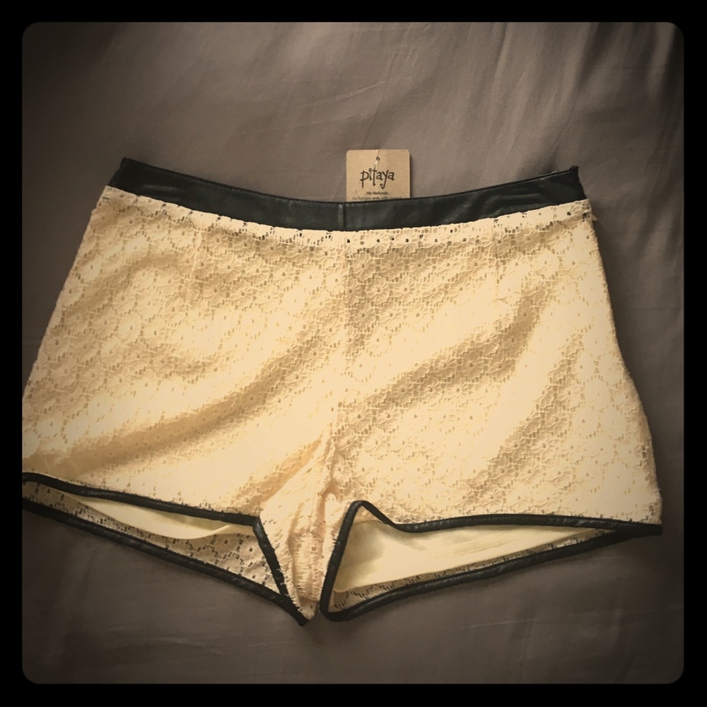 Cream lace shorts w/ black faux leather trim
