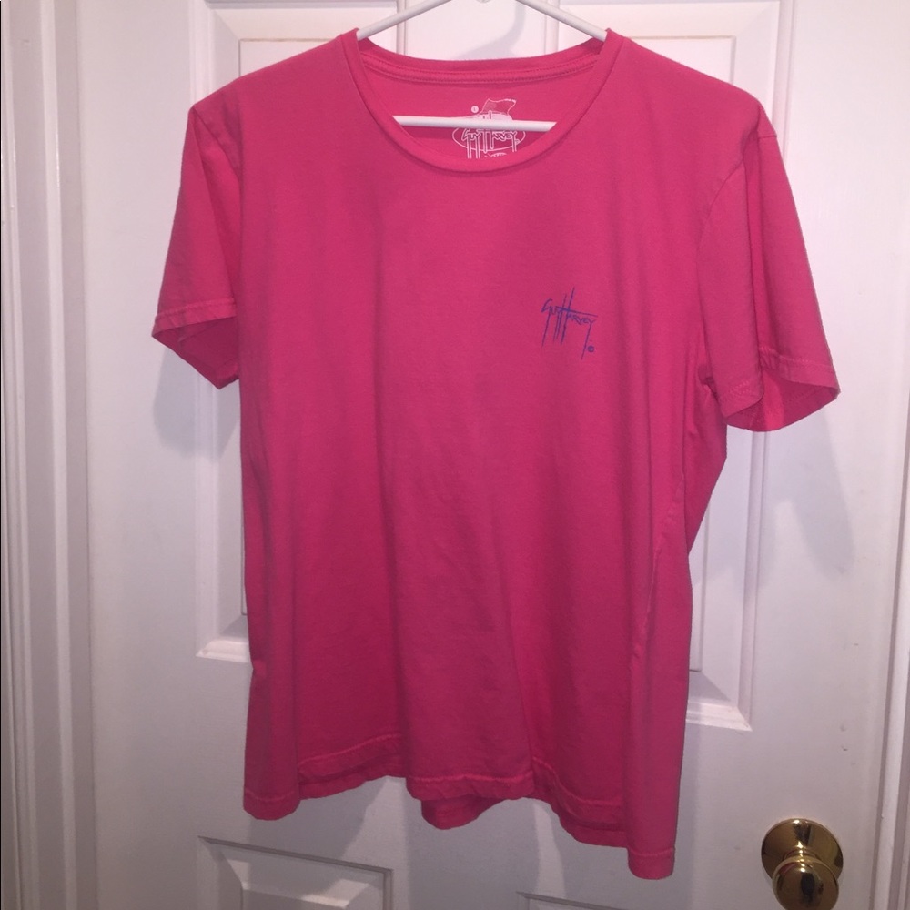 Woman's Guy Harvey shirt.