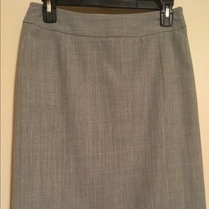 Grey business skirt with pleats in the back
