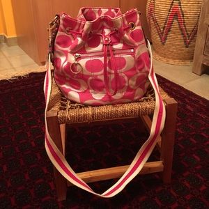 Pink and silver "C" Coach sack style bag.