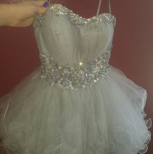 Silver beaded dress with lace up back and zipper.
