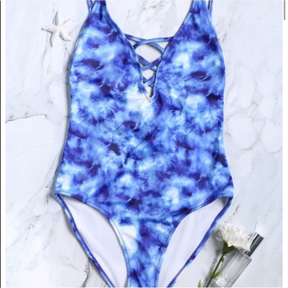 a blue bleached one piece swimsuit