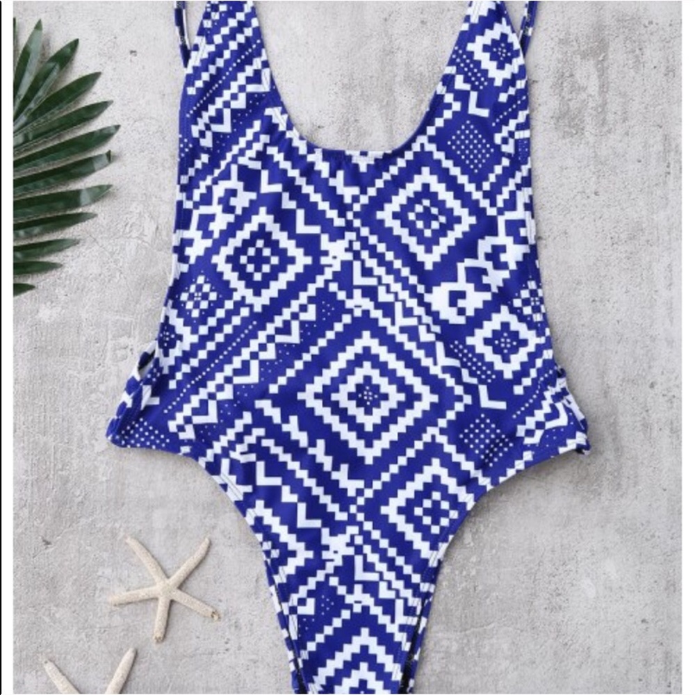 a blue and white aztec printed one piece swimsuit