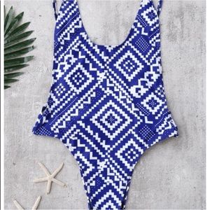 a blue and white aztec printed one piece swimsuit