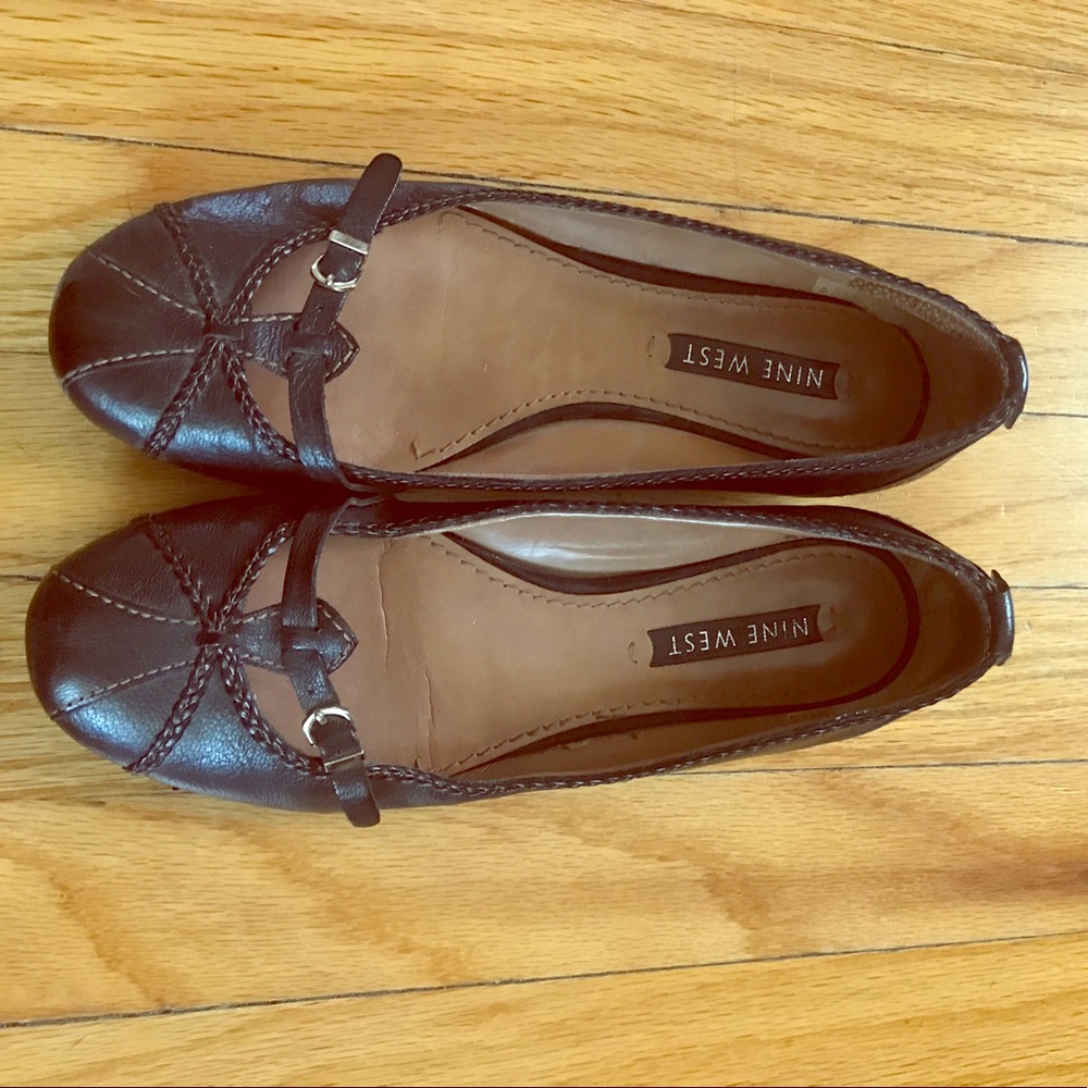 Nine West black flats with small gold buckle.