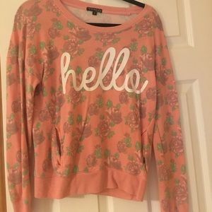 Pink floral shirt that says hello.