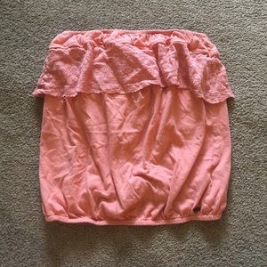 Strapless coral colored crop top with fringe