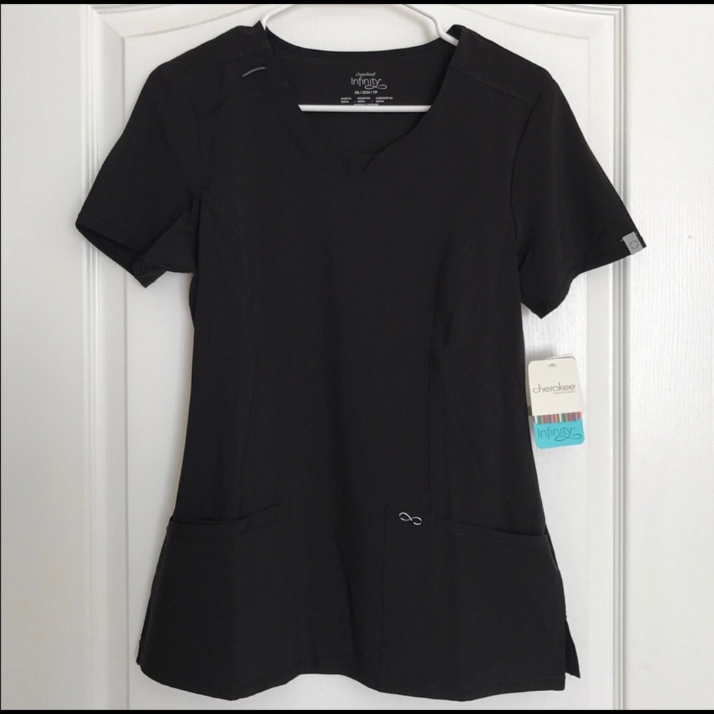 New with tags Cherokee Infinity scrub top in XS