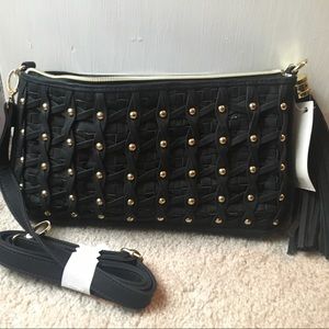 Black hand bag includes tassel and strap