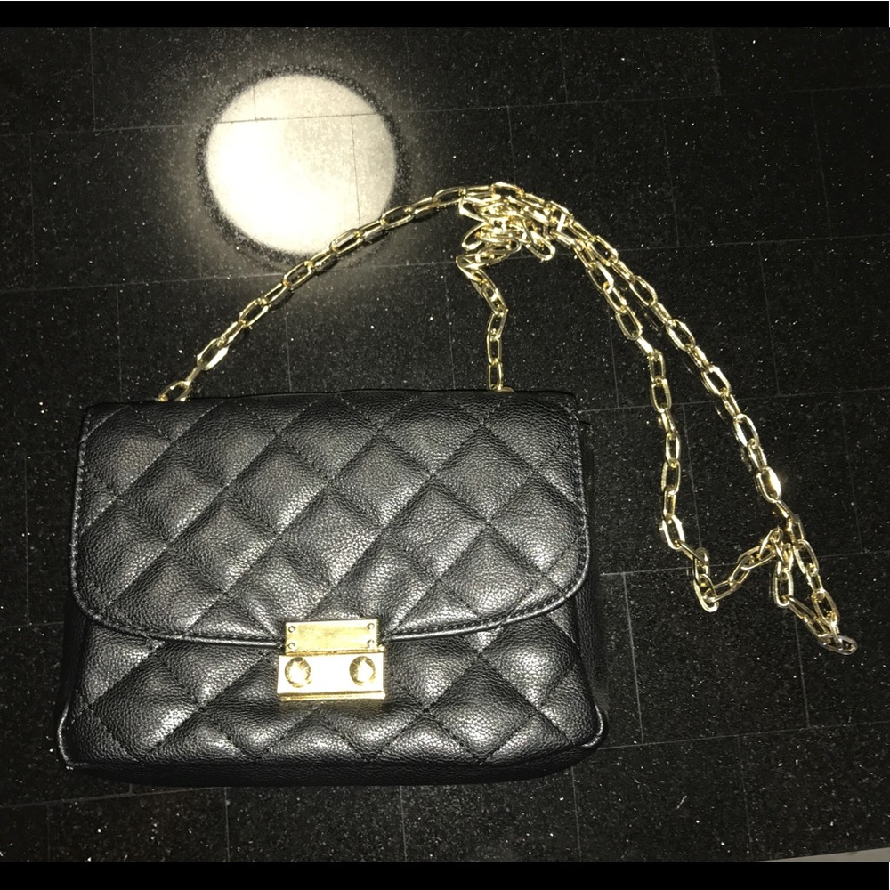 Black and gold cross body purse, like new