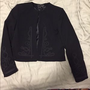 Black collarless suit jacket