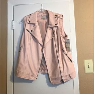 Pink waist length leather vest.