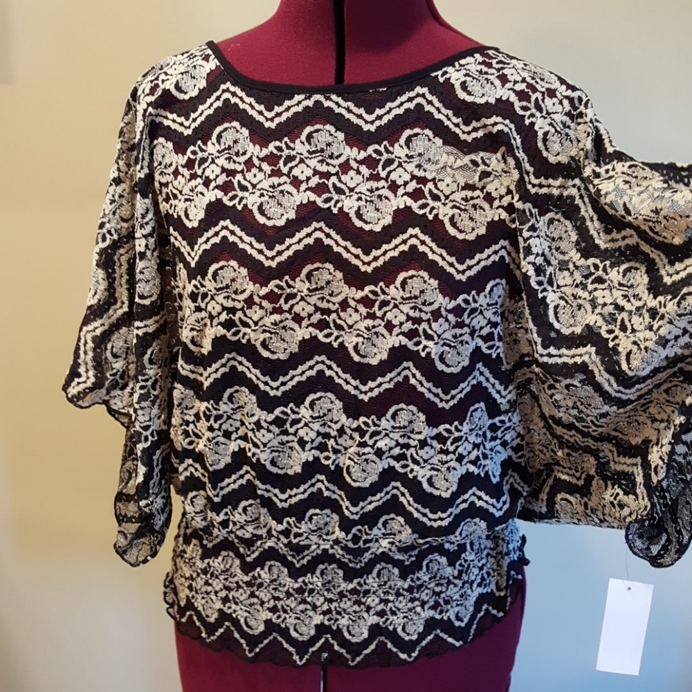 Ladies cold shoulder rouched waist top.