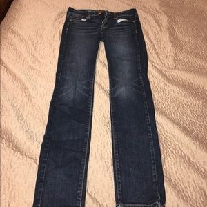 American Eagle dark blue jeans.