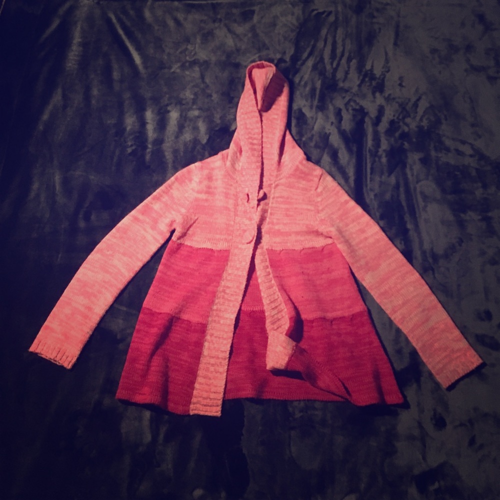 Pink button up sweater.