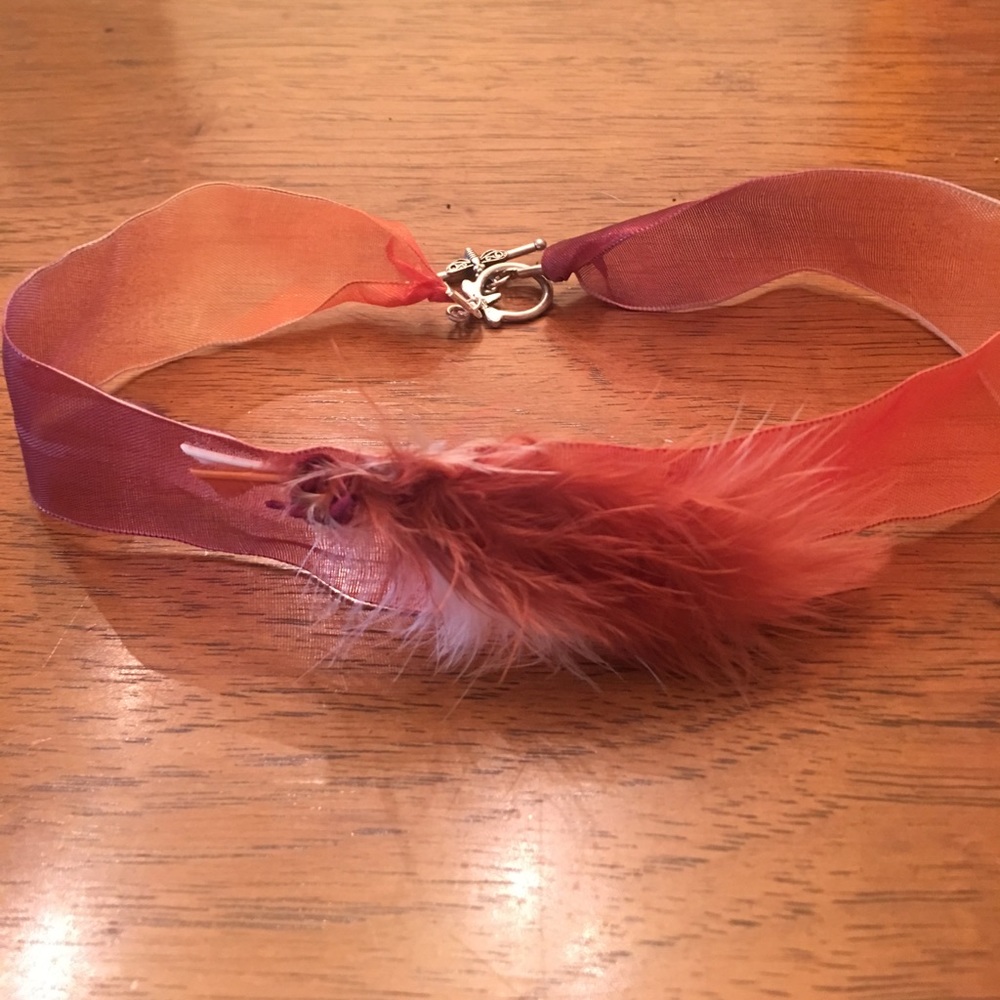Ribbon choker with feathers. Toggle closure.