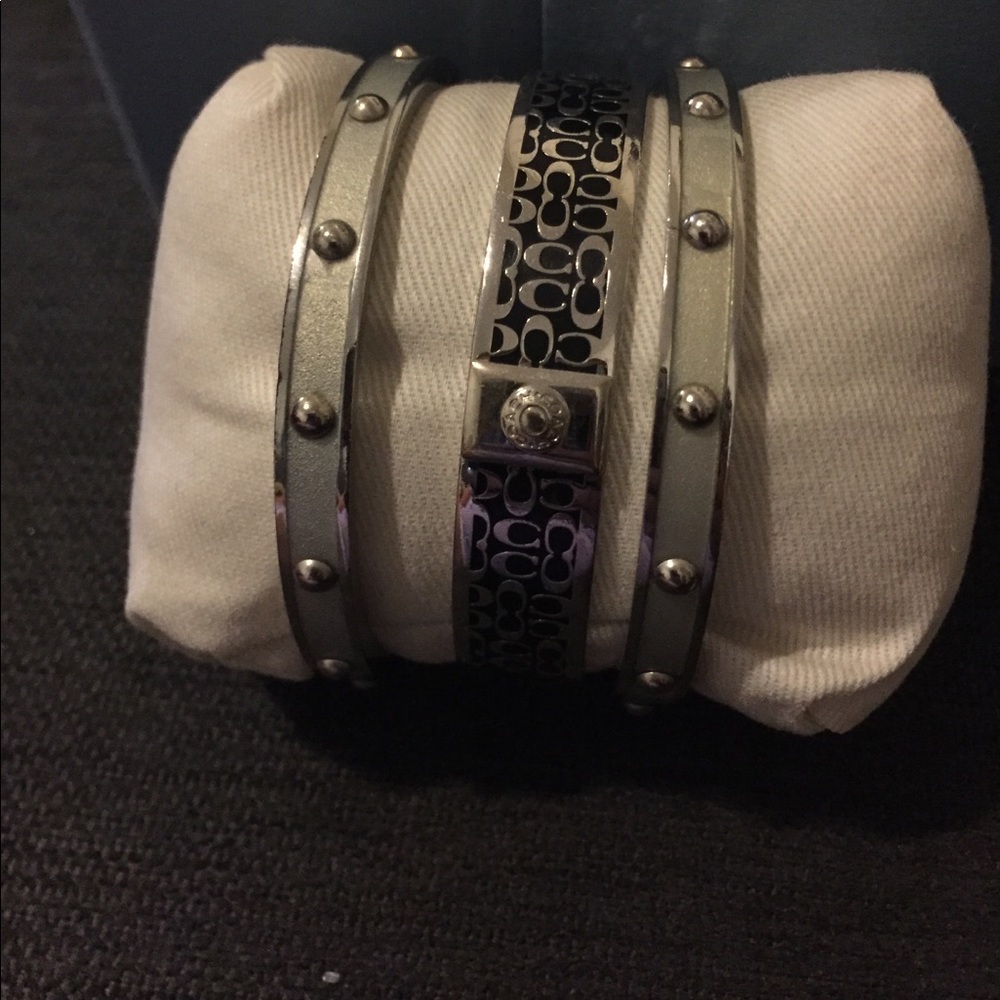 3 separate coach bracelets