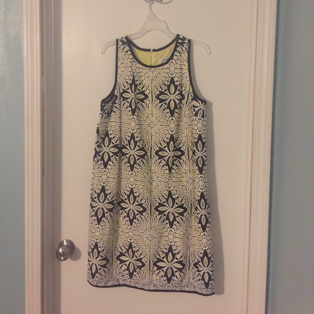 Sleeveless lace shift dress.