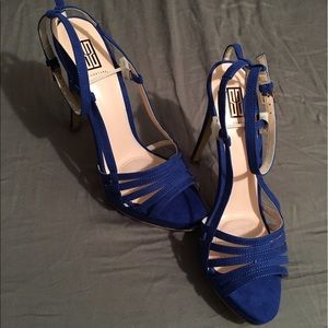 Never worn, suede, royal blue heels.