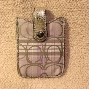 Coach ID and card holder.