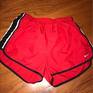 RED NIKE SHORTS. WOMEN'S M.