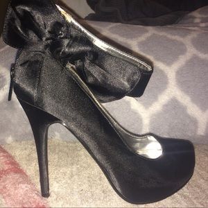 Black stilettos with bow and ankle strap