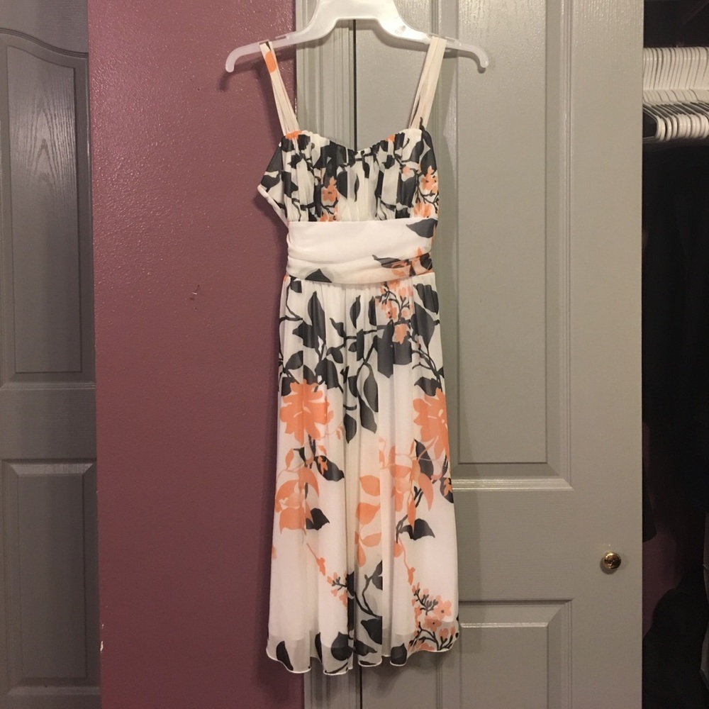 White dress orange and black floral design