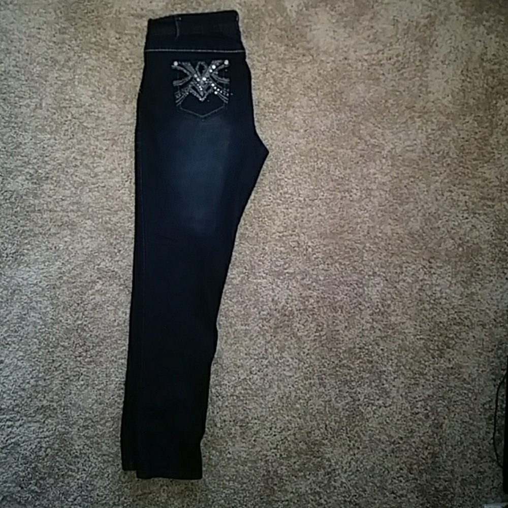 Women's blue jeans w/ rhinestone detail on pockets