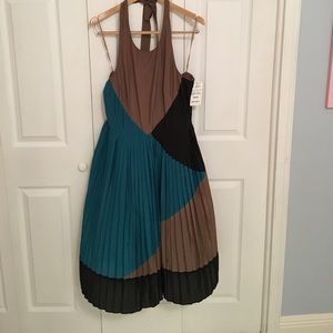 Fit and flair pleated skirt halter dress