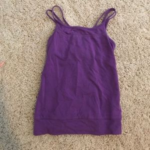 Girls purple tank top with crossed straps.