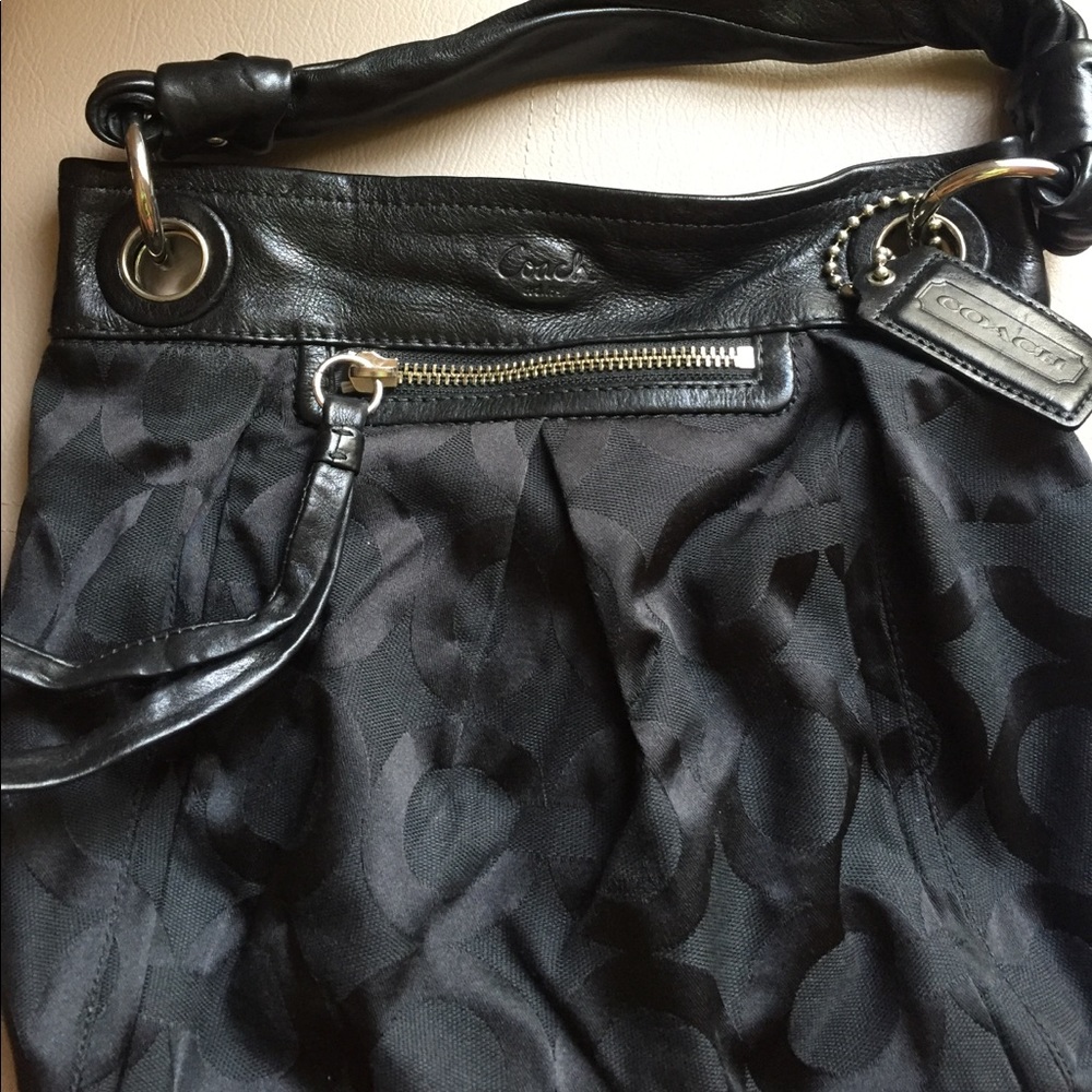 Black Coach bag with crossbody strap included!