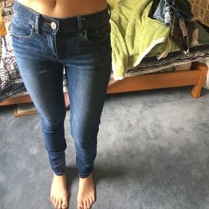 Express medium wash mid rise jean legging