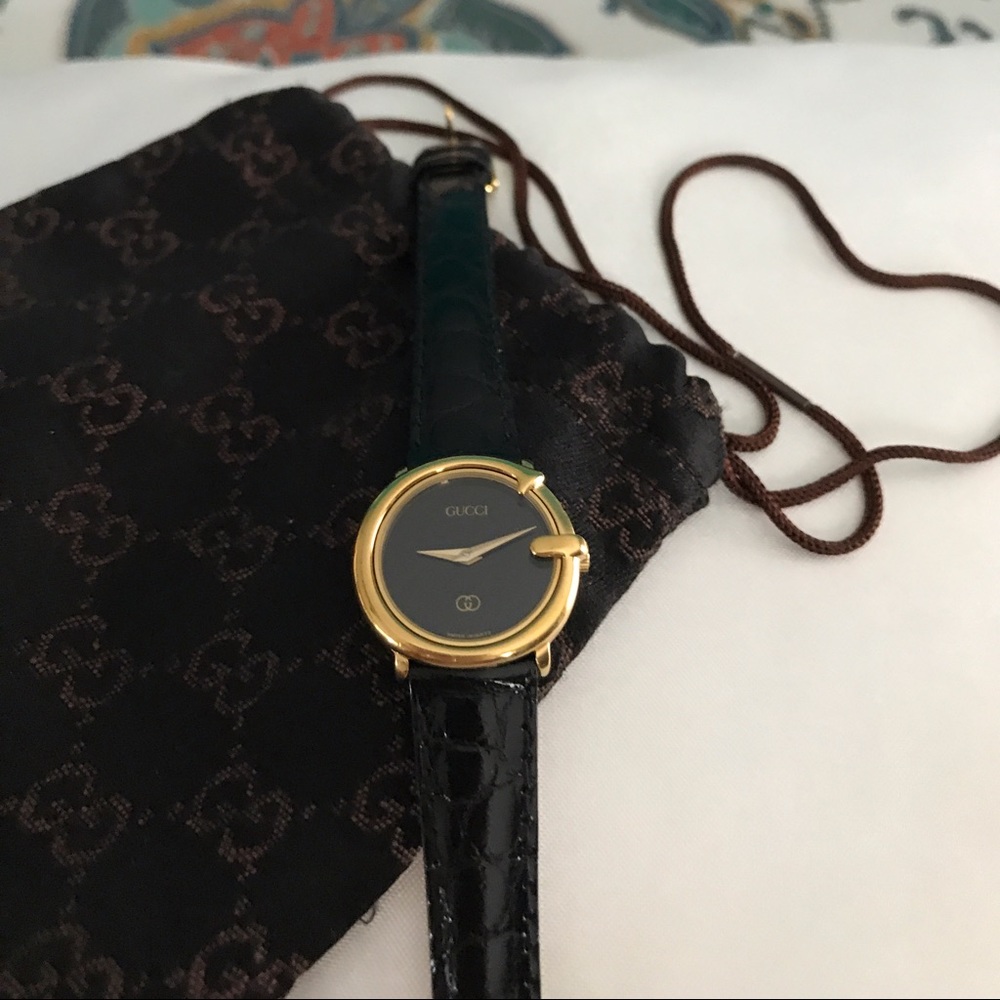 Gucci leather and gold watch