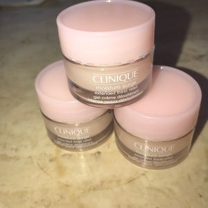 Three Clinique moisture surge minis .5 oz each
