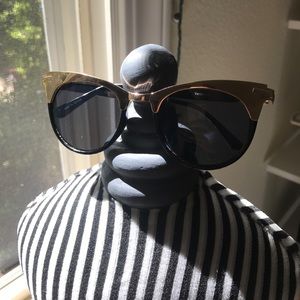 Gold rimmed sunglasses