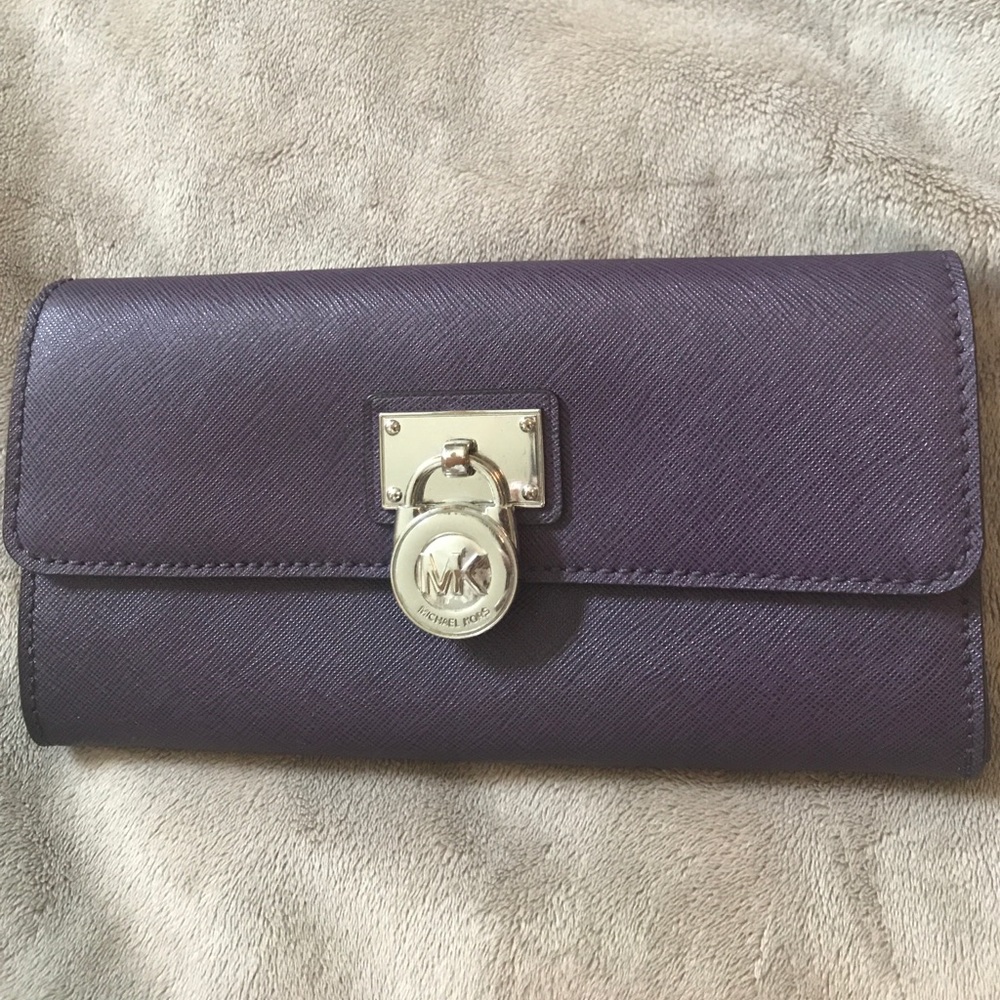 Spacious purple leather Michael Kors wallet.