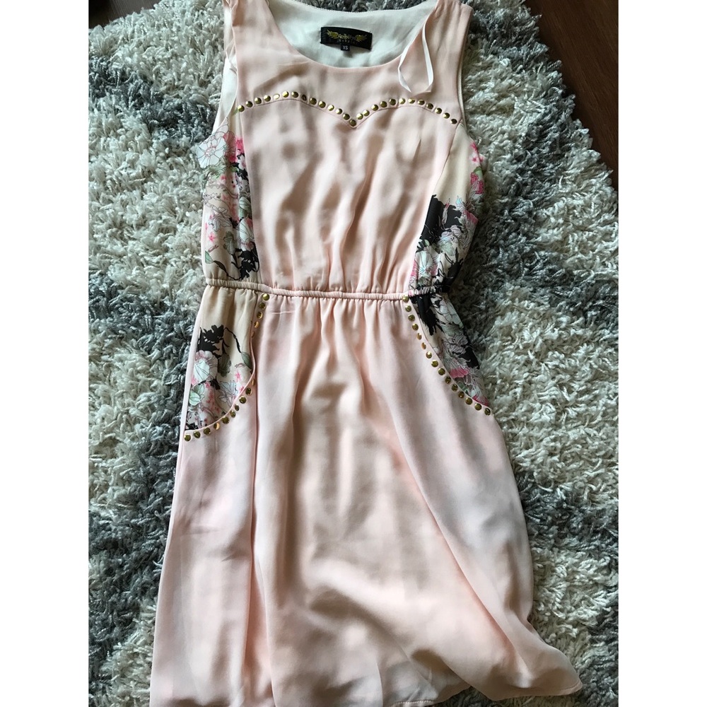 Blush dress with floral and stud accents