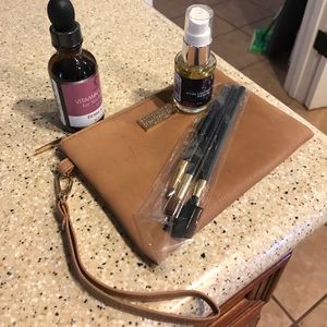 2 Serums, Eminence clutch, & 3 make up brushes