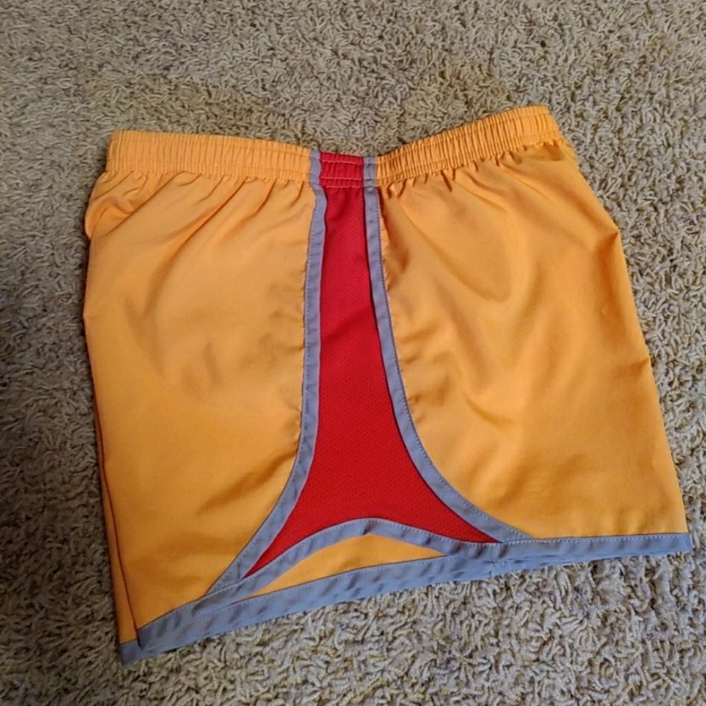New orange and red Nike shorts.