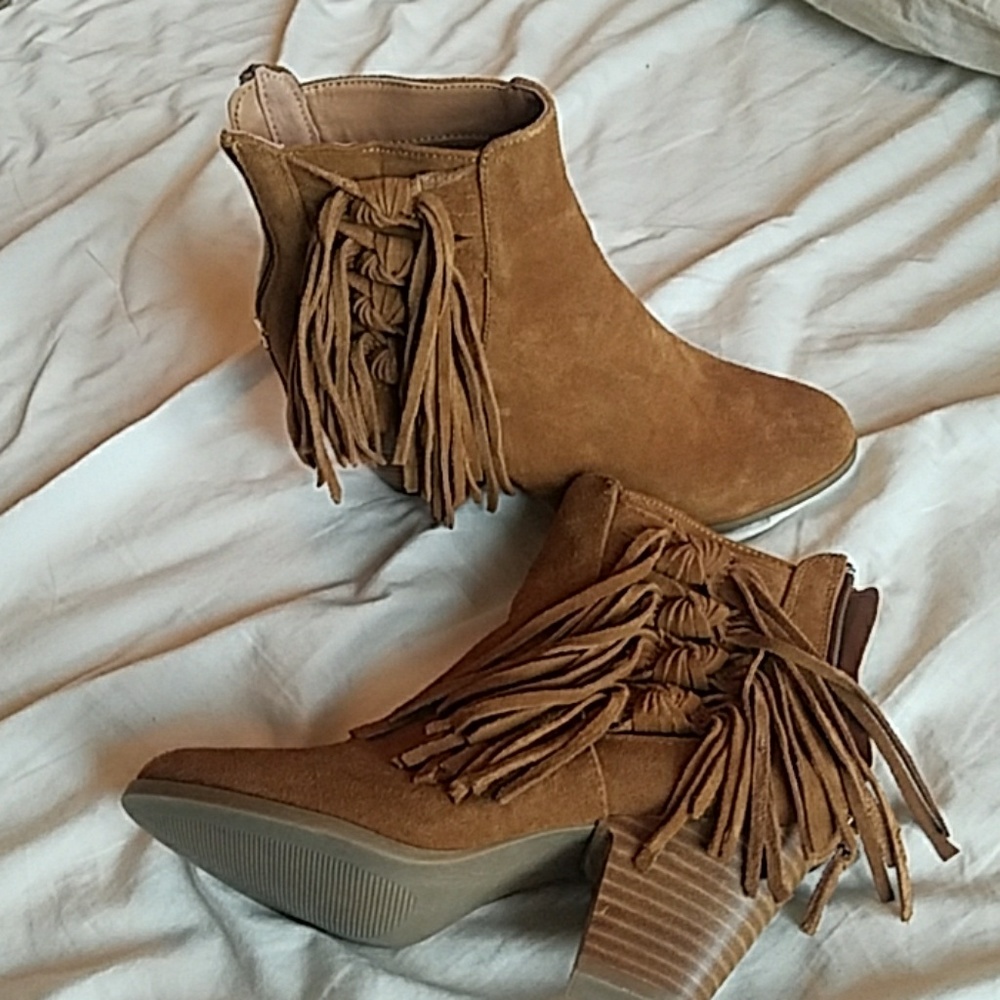 Like new, leather tassled heeled booties