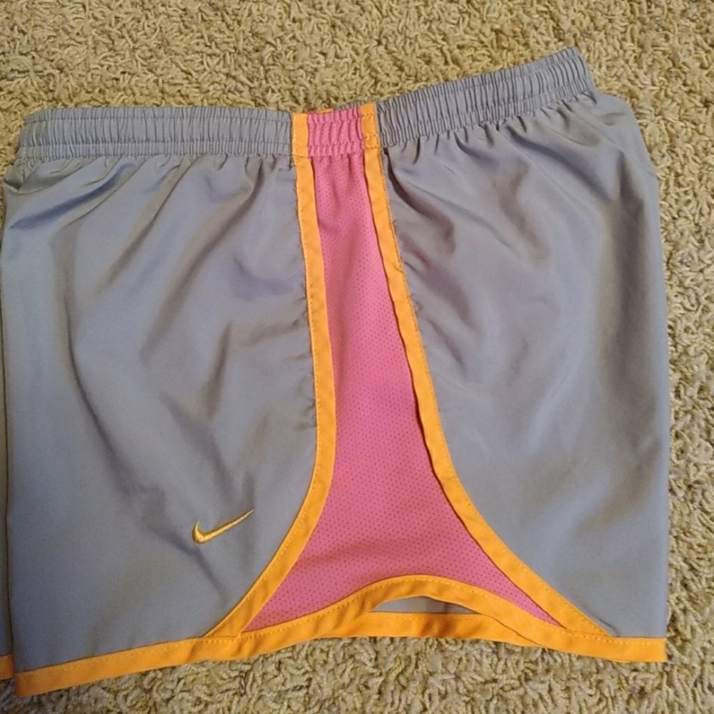 Orange, gray, and pink Nike's
