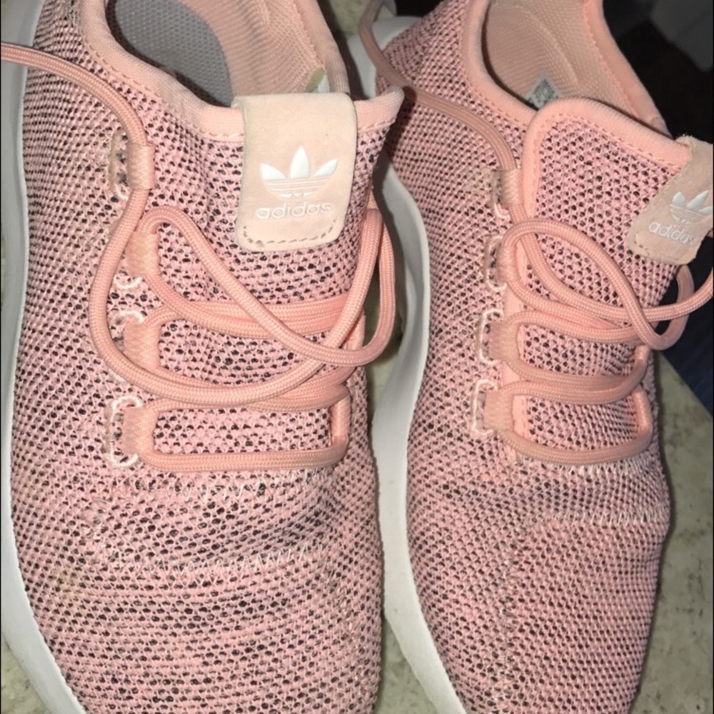 Pink tubular Adidas tennis shoes