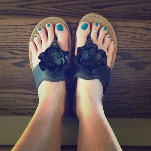 Black leather flip flops