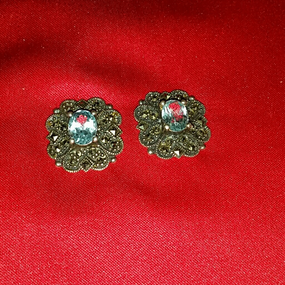 Silver earrings with blue topaz