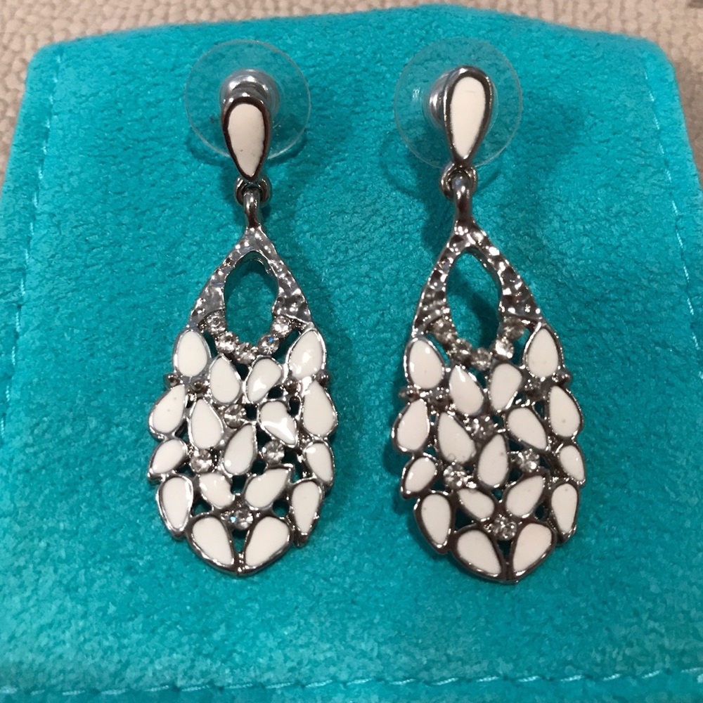 White and silver earrings