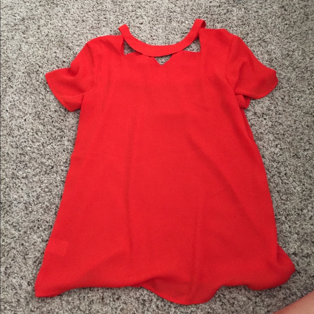 orange/ red colored top with a detailed collar