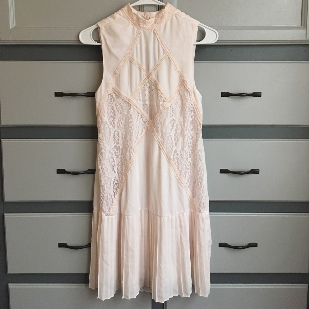 Ivory dress with pleating, lace and crochet detail